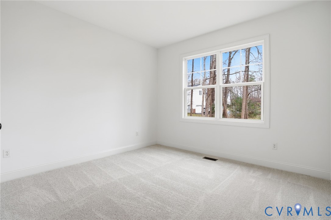 1404 Mill Quarter Road Powhatan, VA 23139 - Photo 18 of 29 an empty room with a window