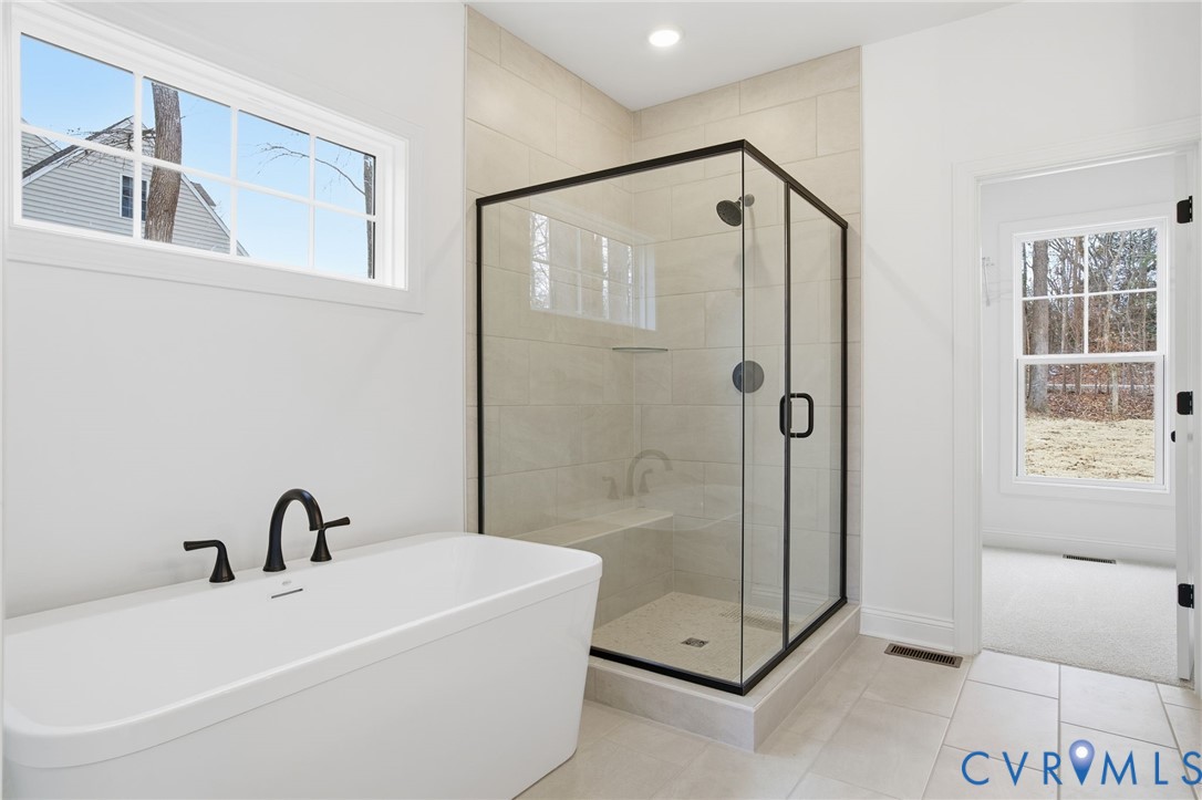 1404 Mill Quarter Road Powhatan, VA 23139 - Photo 4 of 29 a bathroom with a bathtub and a shower