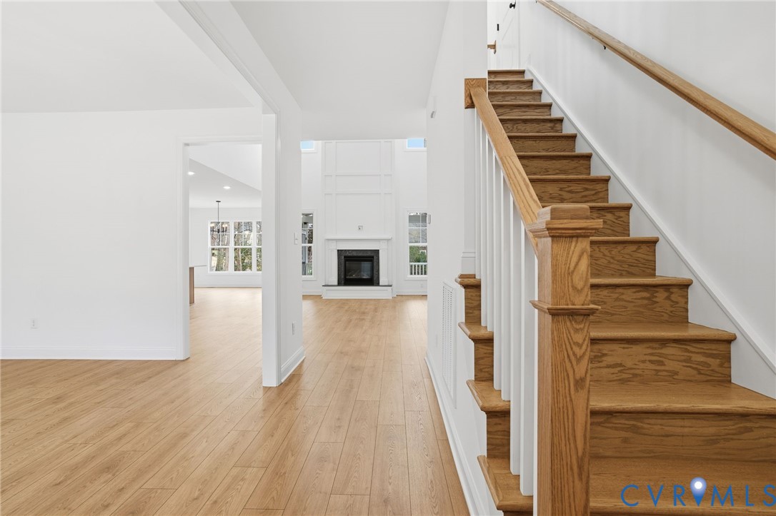 1404 Mill Quarter Road Powhatan, VA 23139 - Photo 7 of 29 a view of a living room with wooden floor and stairs