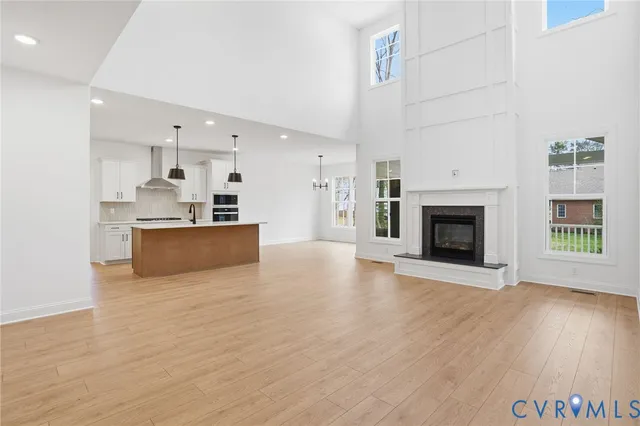 a view of a kitchen with furniture and a fireplace