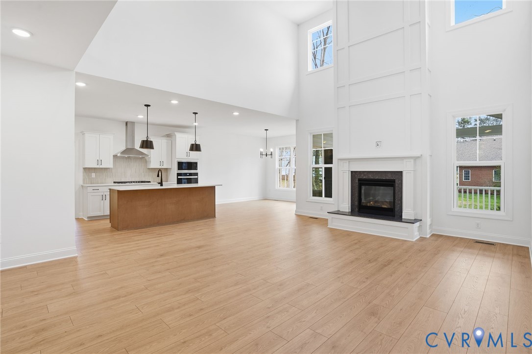 1404 Mill Quarter Road Powhatan, VA 23139 - Photo 9 of 29 a view of a kitchen with furniture and a fireplace