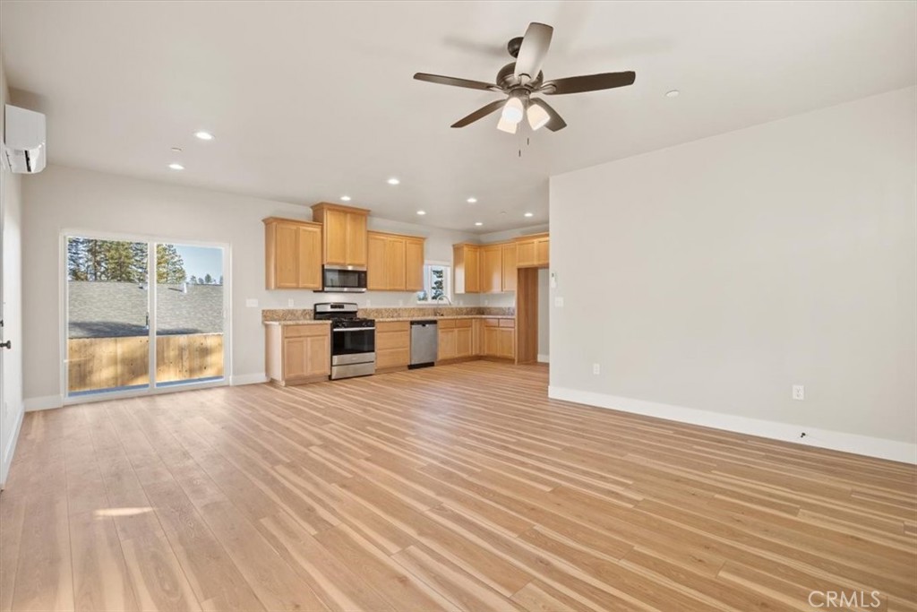 1309 Nunneley Road Paradise, CA 95969 - Photo 12 of 22 a view of a kitchen with a stove cabinets and wooden floor
