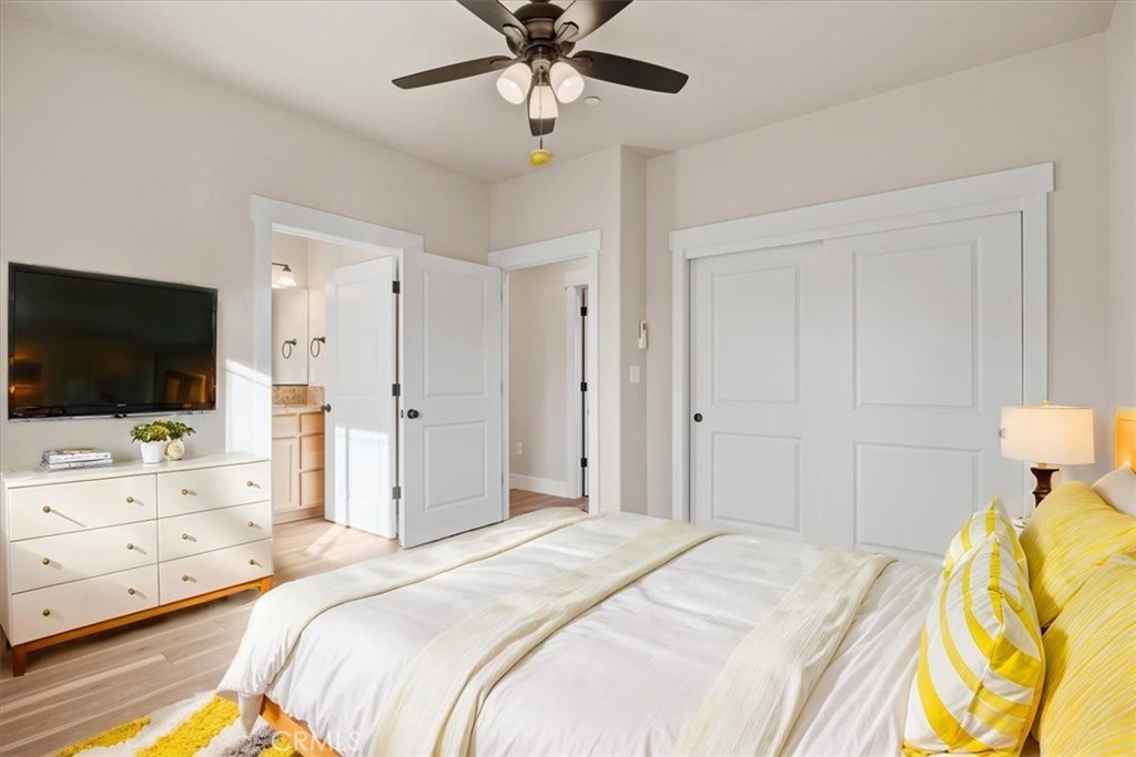 1309 Nunneley Road Paradise, CA 95969 - Photo 14 of 22 a bedroom with a bed and a flat tv screen on dresser