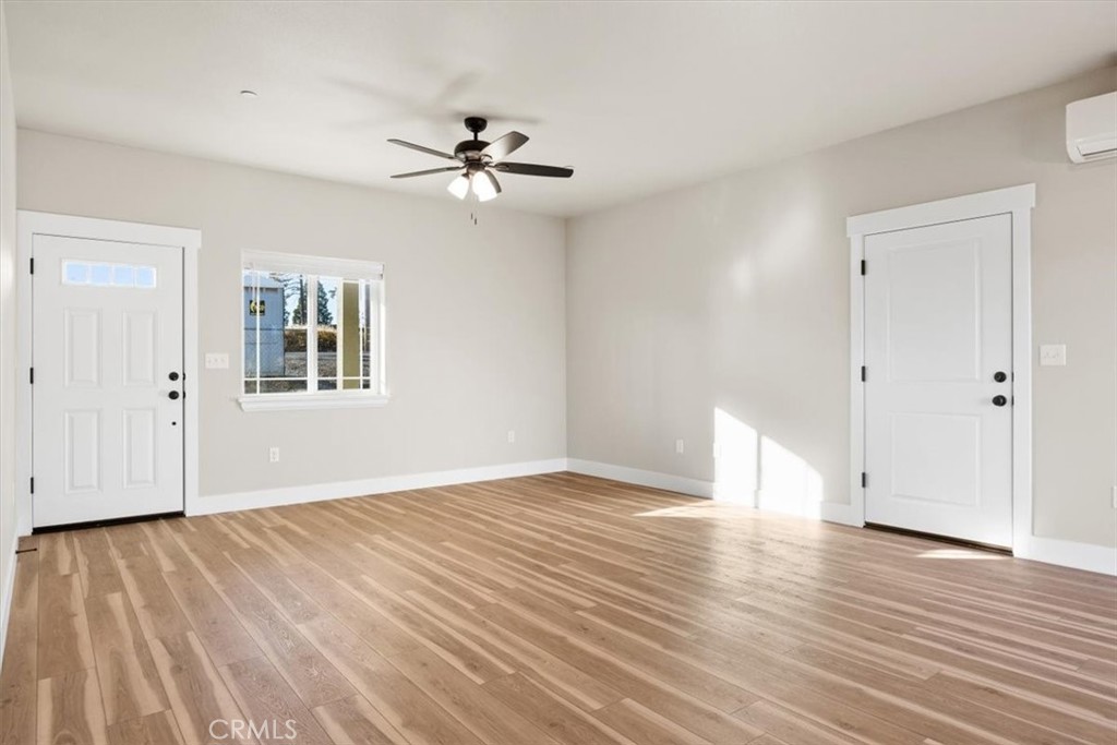 1309 Nunneley Road Paradise, CA 95969 - Photo 5 of 22 a view of an empty room with wooden floor