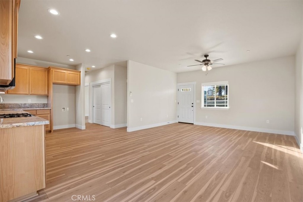 1309 Nunneley Road Paradise, CA 95969 - Photo 7 of 22 a view of empty room with wooden floor and fan