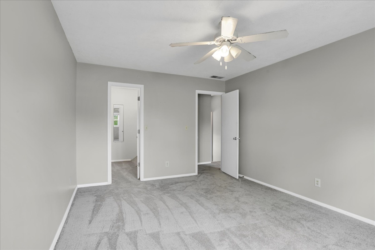 1717 King Drive, Unit B Normal, IL 61761 - Photo 14 of 18 a view of an empty room with a chandelier fan