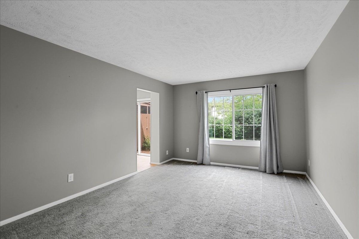 1717 King Drive, Unit B Normal, IL 61761 - Photo 3 of 18 wooden floor and window in an empty room