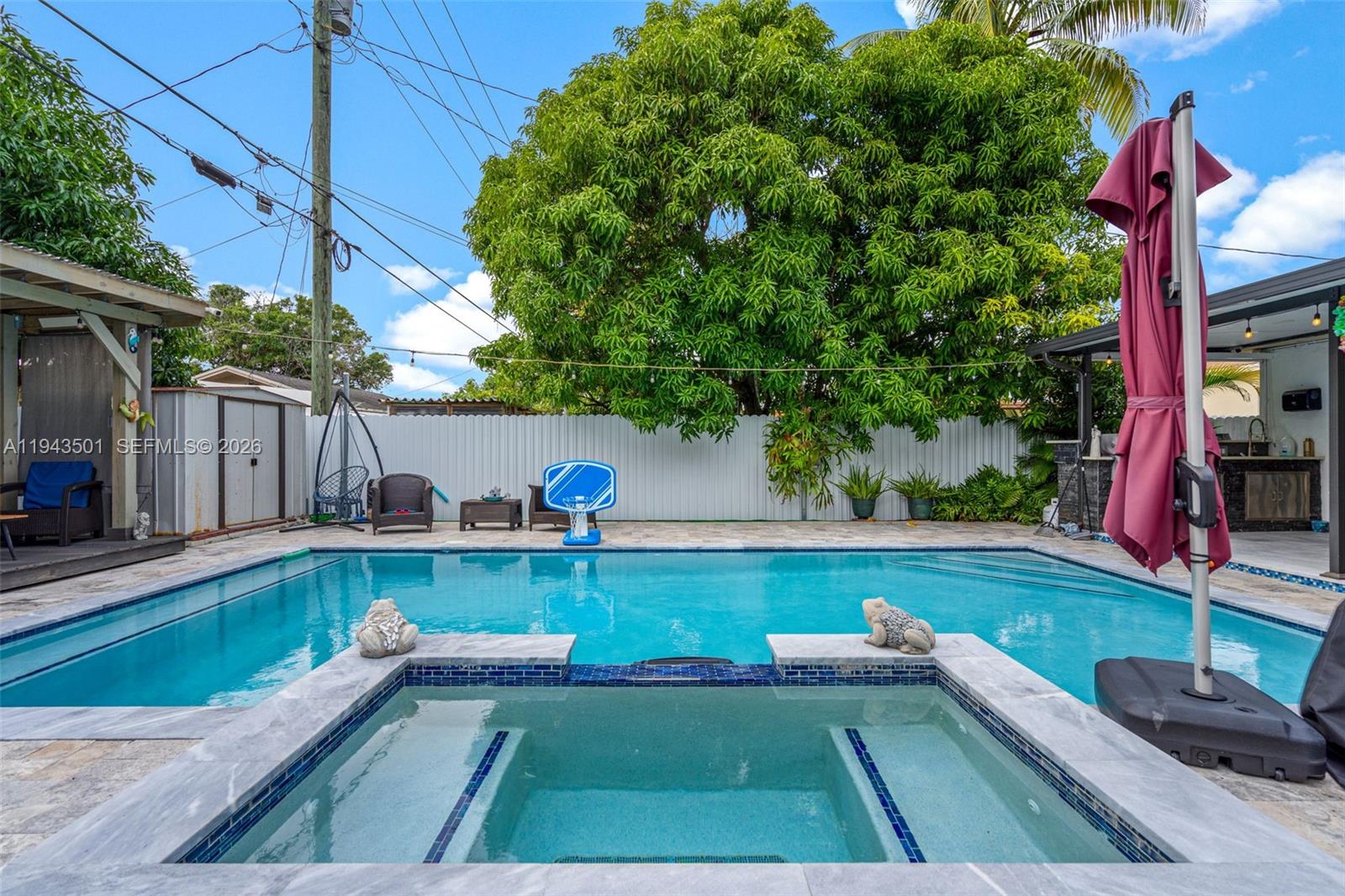 864 East 29th Street Hialeah, FL 33013 - Photo 15 of 16 a view of a backyard with swimming pool