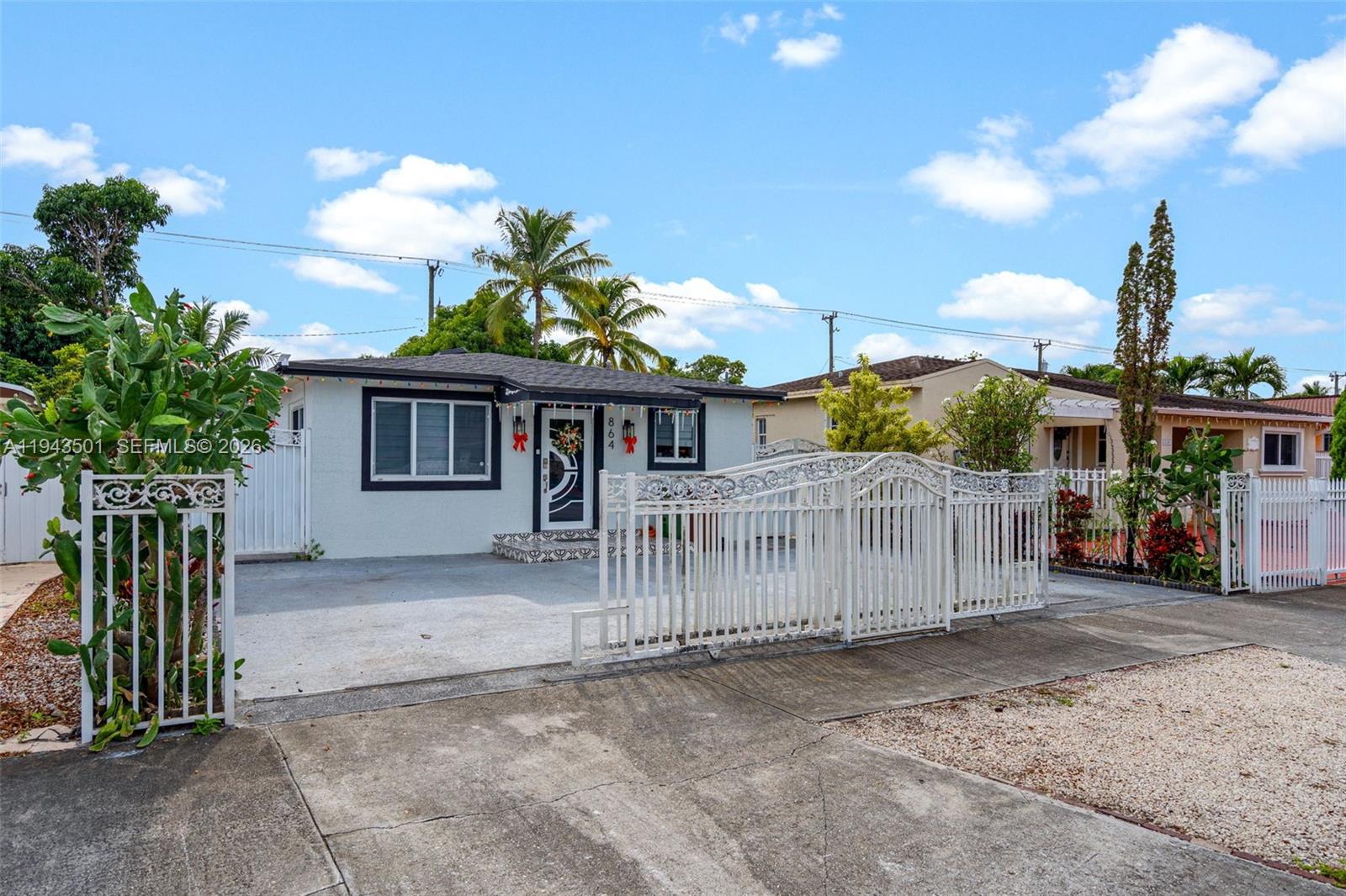 864 East 29th Street Hialeah, FL 33013 - Photo 2 of 16 a view of a house with a wooden fence