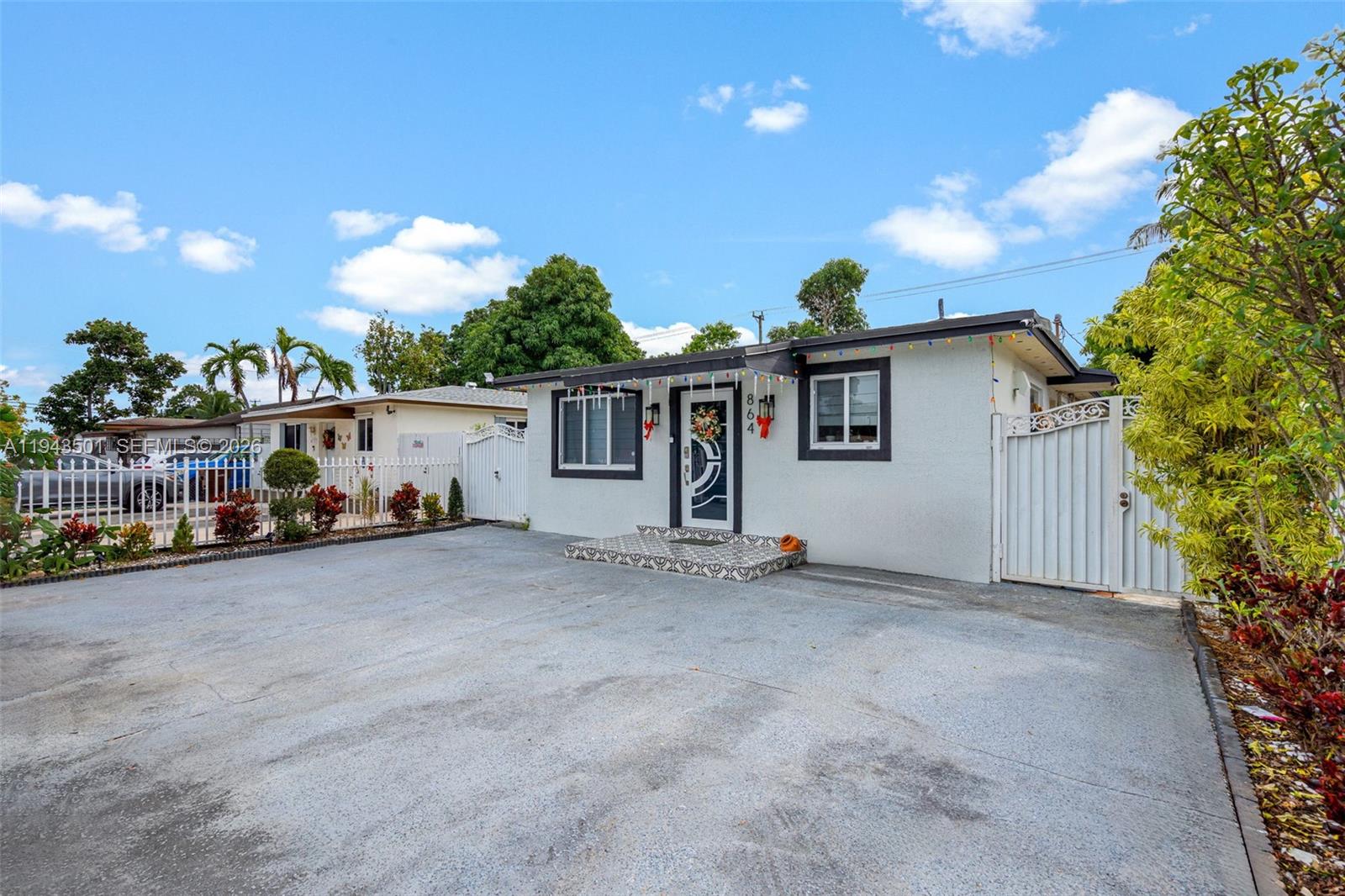 864 East 29th Street Hialeah, FL 33013 - Photo 3 of 16 a view of a house with a patio