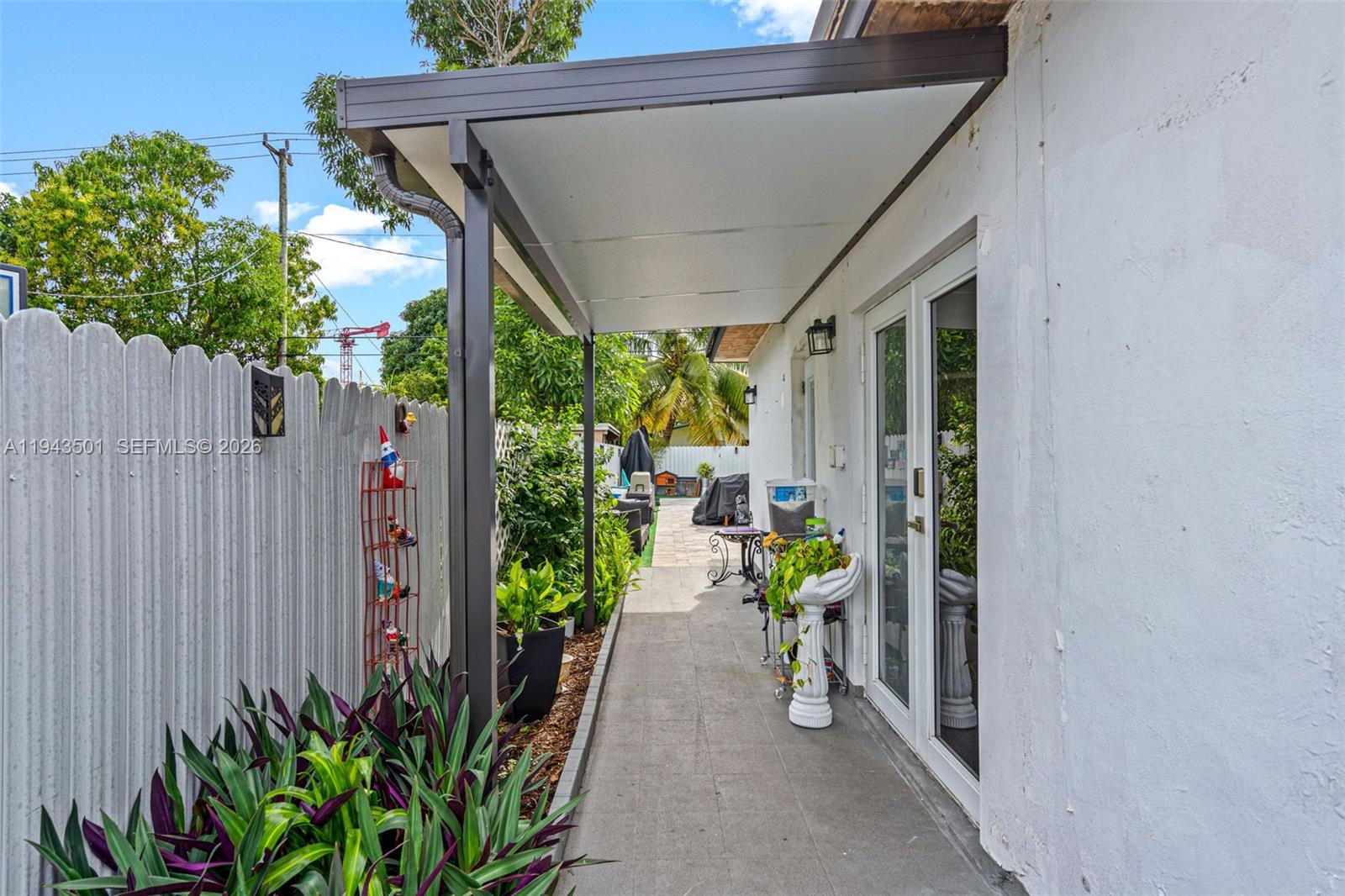 864 East 29th Street Hialeah, FL 33013 - Photo 5 of 16 a view of a path along with potted plants
