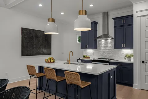 a kitchen with stainless steel appliances a sink and a stove