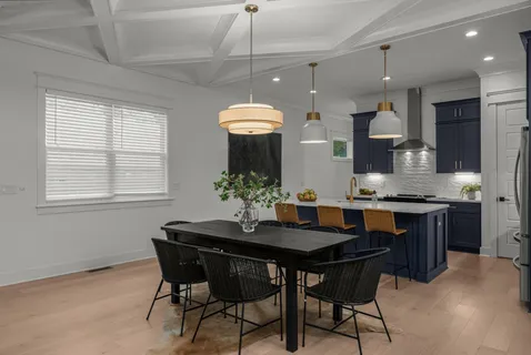 a kitchen with a table and chairs in it