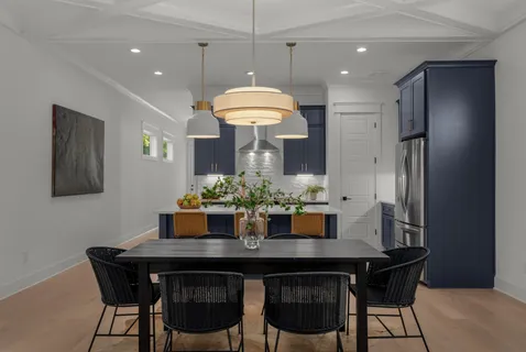 a dining room with a table and chairs