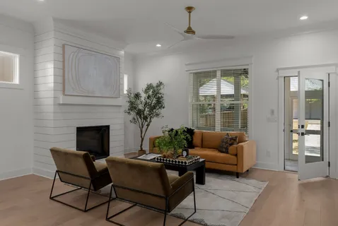 a living room with furniture and a fireplace