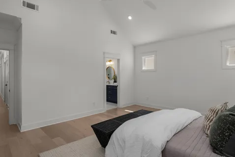 a bedroom with a bed and window