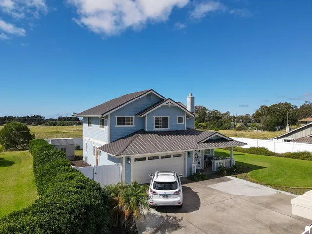 a house with trees in the background