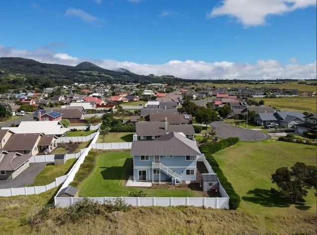 a view of a city with mountains in the background