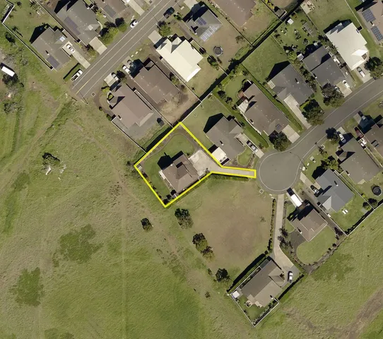 an aerial view of residential house with swimming pool