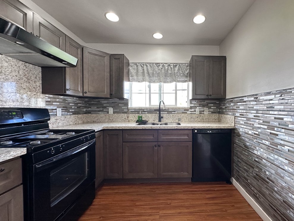 67-1310 Puaena Street Kamuela, HI 96743 - Photo 7 of 26 a kitchen with stainless steel appliances granite countertop a stove a sink and a granite counter tops