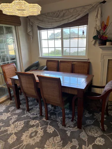 a view of a dining room with furniture window and outside view