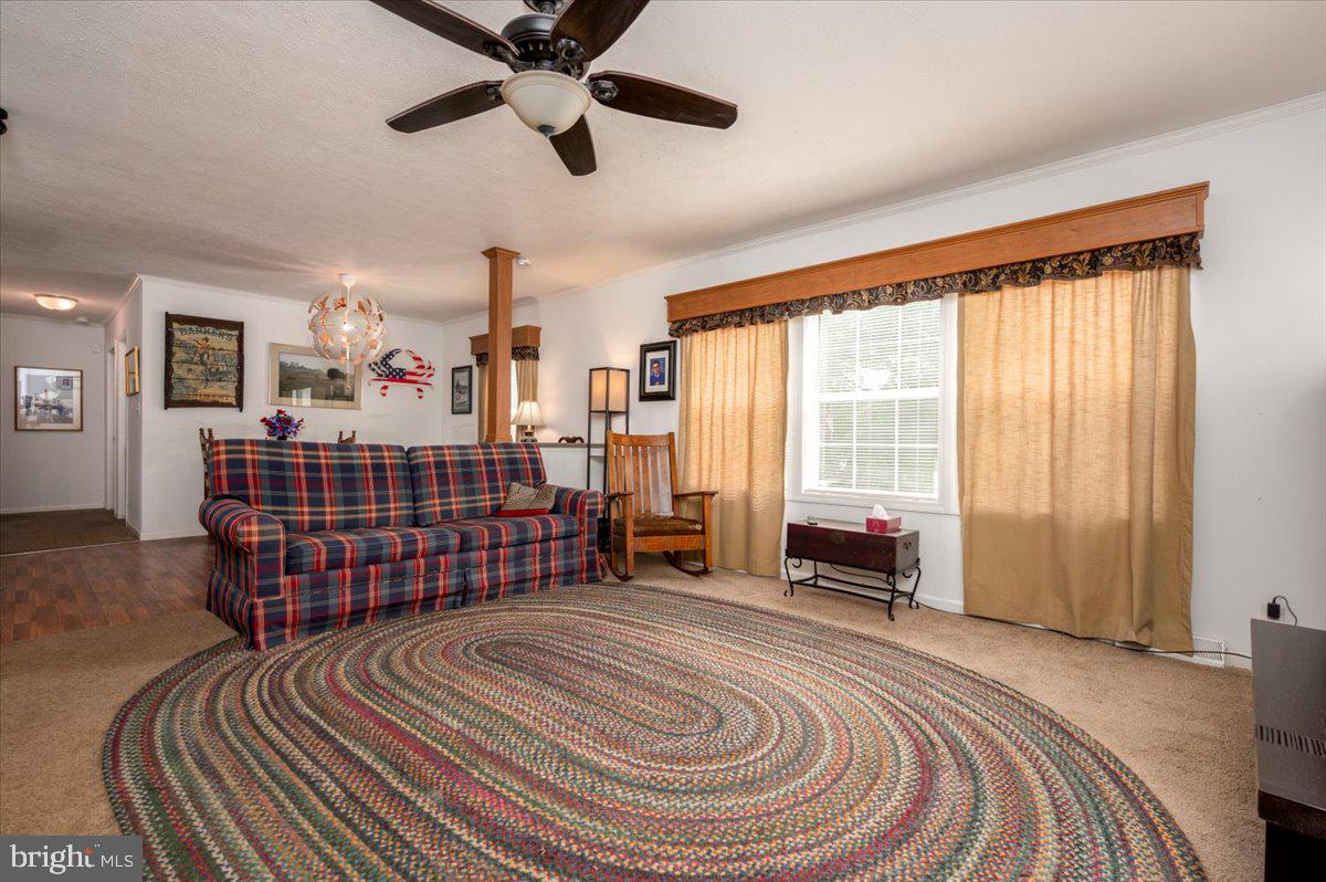 302 Berts Drive Lothian, MD 20711 - Photo 12 of 38 a bedroom with a bed and wooden floor