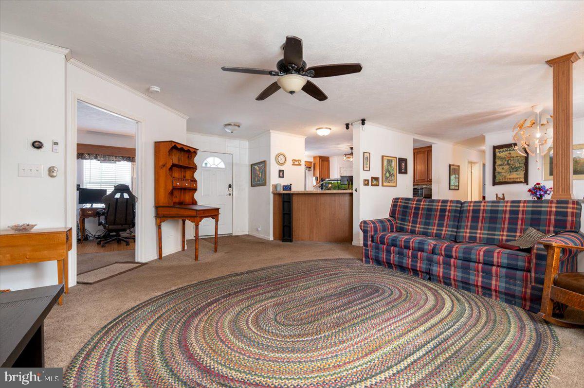 302 Berts Drive Lothian, MD 20711 - Photo 13 of 38 a spacious bedroom with a bed and wooden floor