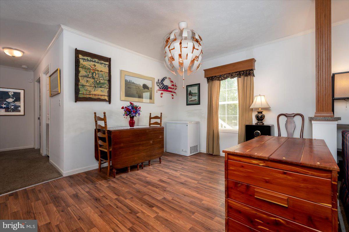 302 Berts Drive Lothian, MD 20711 - Photo 15 of 38 a room with furniture and a wooden floor