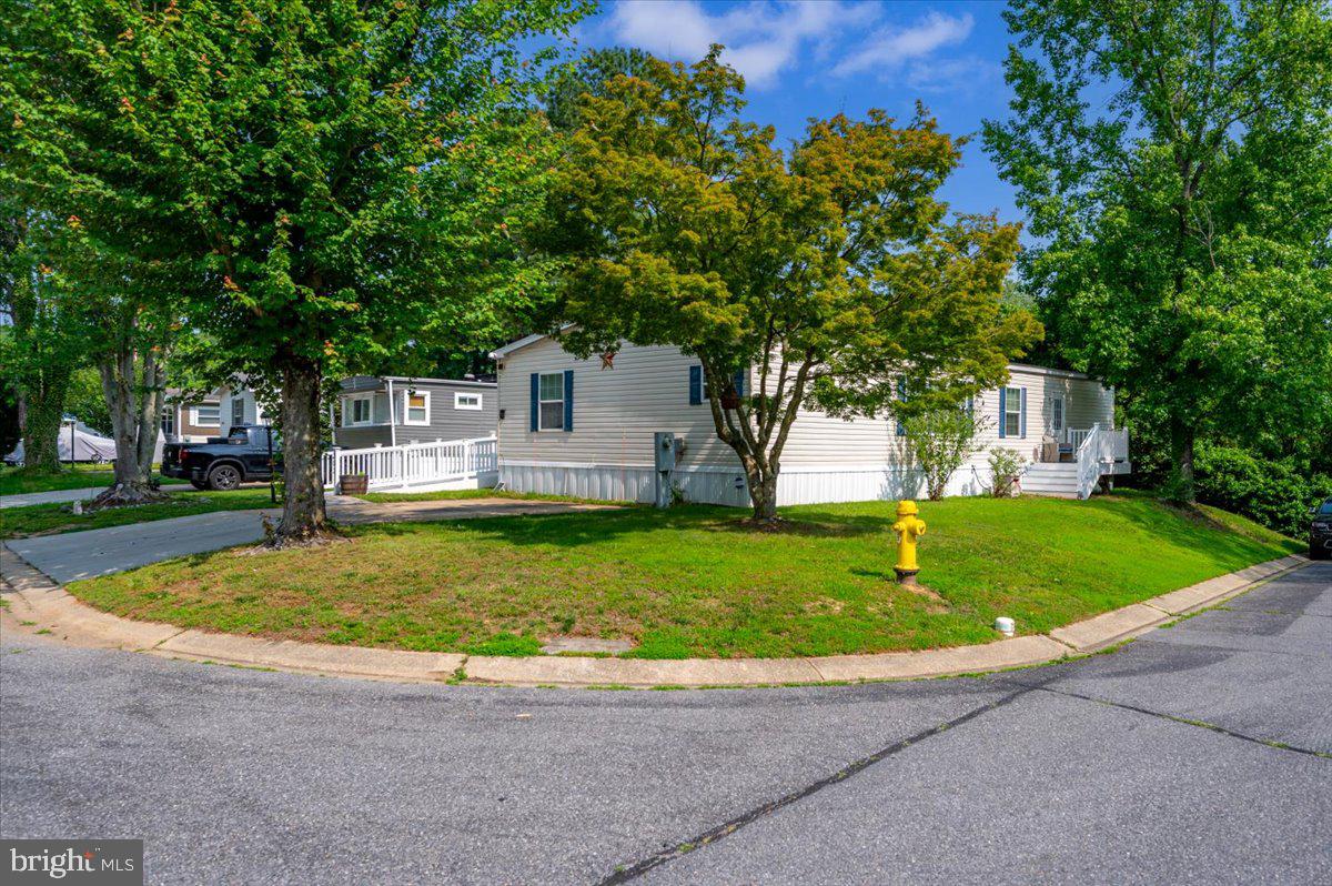 302 Berts Drive Lothian, MD 20711 - Photo 2 of 38 a view of a house with a small yard