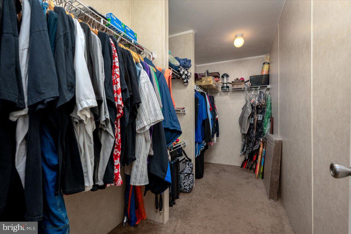 302 Berts Drive Lothian, MD 20711 - Photo 27 of 38 a view of walk in closet with clothes