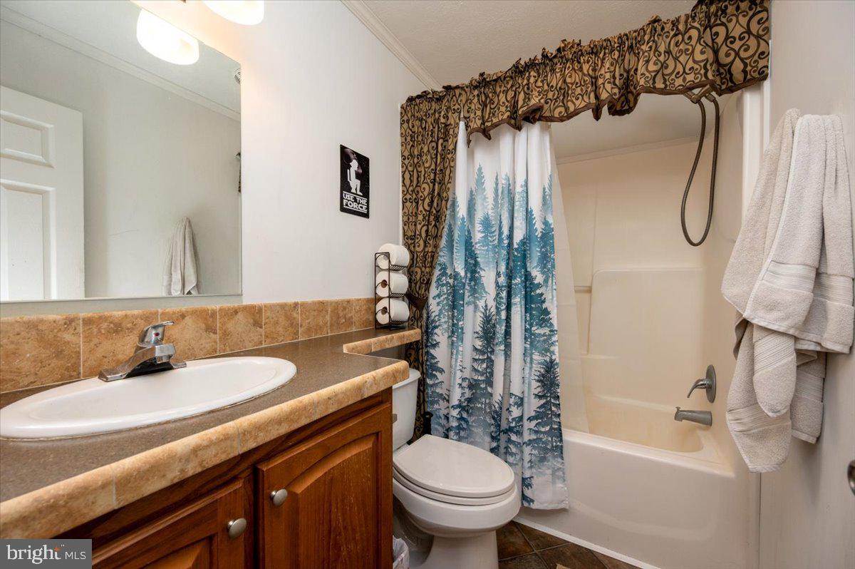 302 Berts Drive Lothian, MD 20711 - Photo 28 of 38 a bathroom with a sink toilet and shower