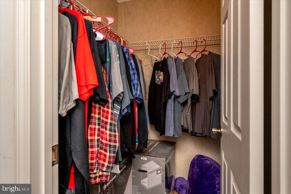 302 Berts Drive Lothian, MD 20711 - Photo 30 of 38 a view of walk in closet with clothes