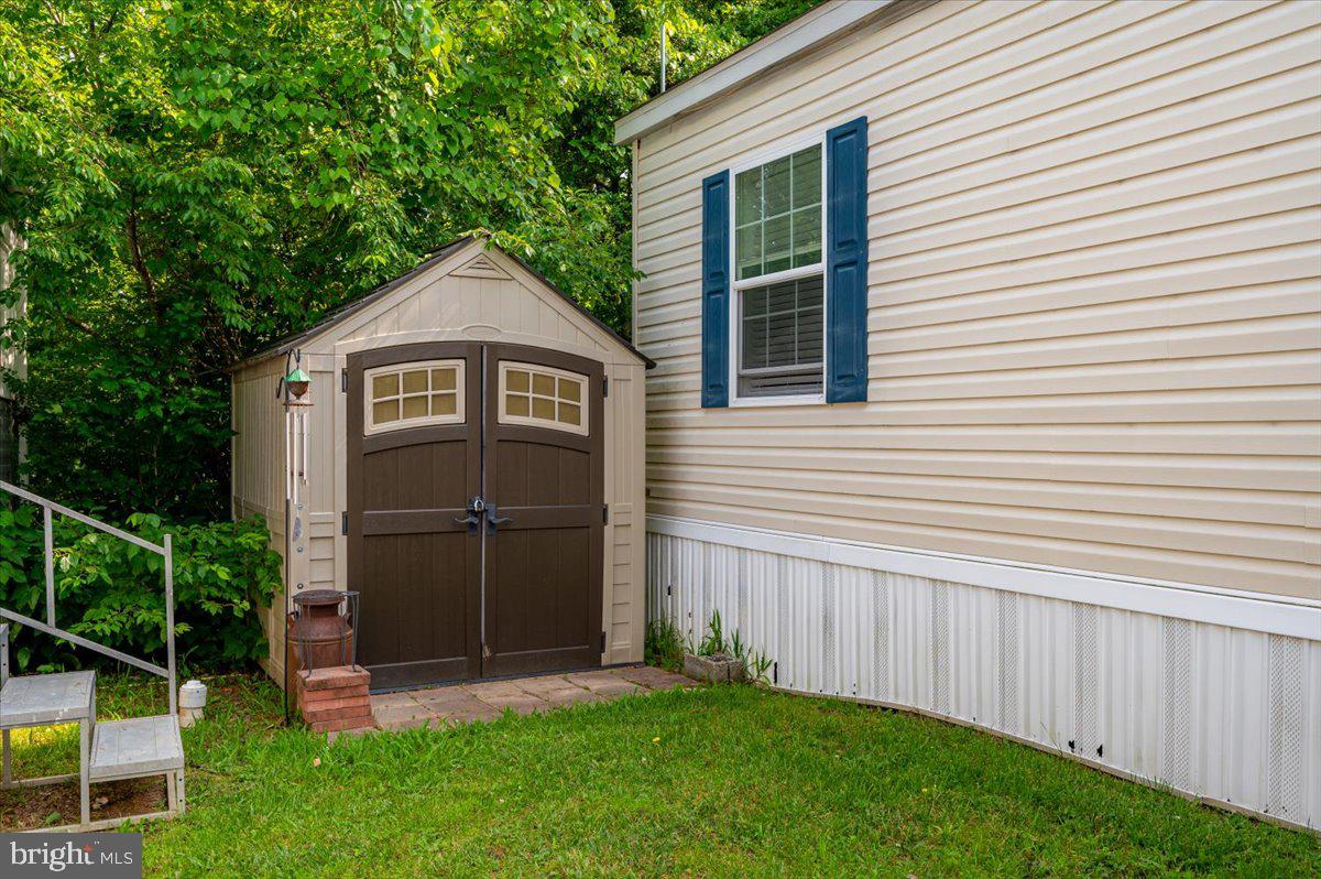 302 Berts Drive Lothian, MD 20711 - Photo 6 of 38 front view of a house with a yard