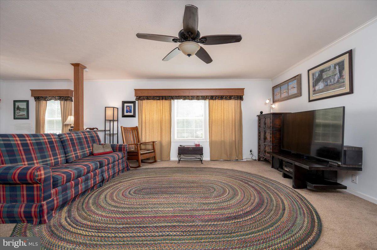 302 Berts Drive Lothian, MD 20711 - Photo 10 of 38 a spacious bedroom with a bed and glass windows