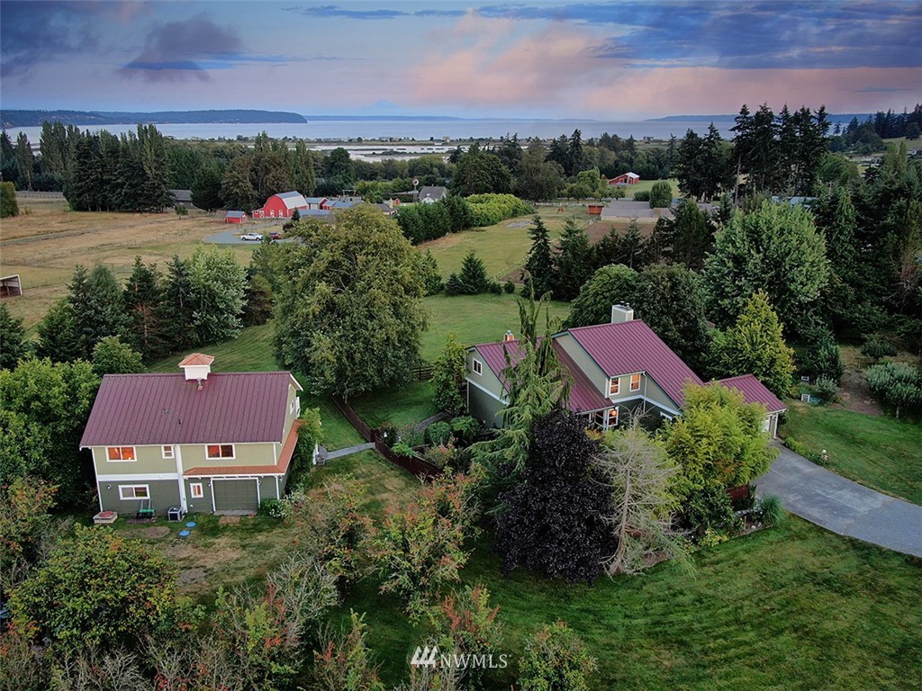 5749 Double Bluff Road Freeland, WA 98249 - Photo 1 of 40 a view of a garden with an outdoor space and seating area