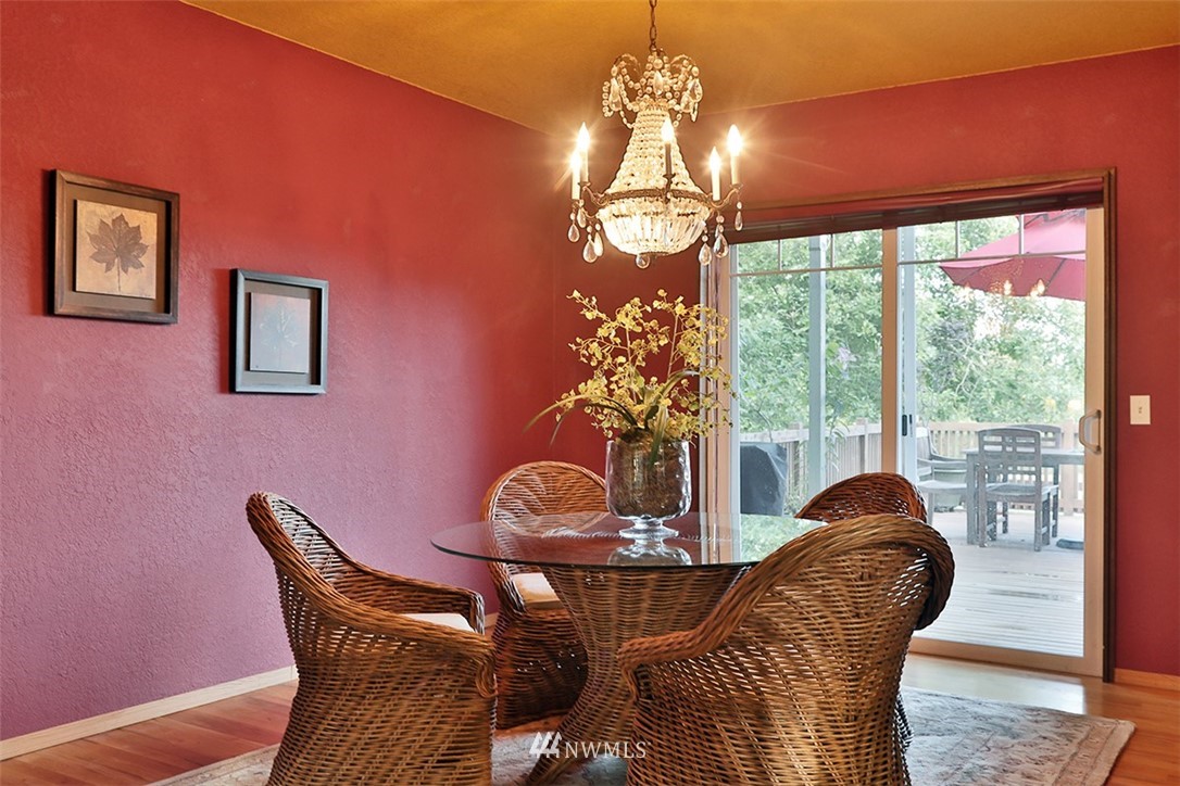 5749 Double Bluff Road Freeland, WA 98249 - Photo 15 of 40 a dining room with furniture and chandelier
