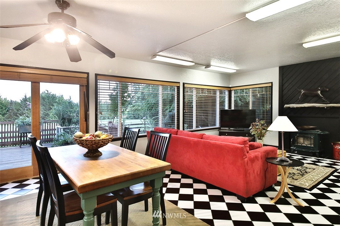 5749 Double Bluff Road Freeland, WA 98249 - Photo 18 of 40 a view of a dining room with furniture window and outside view