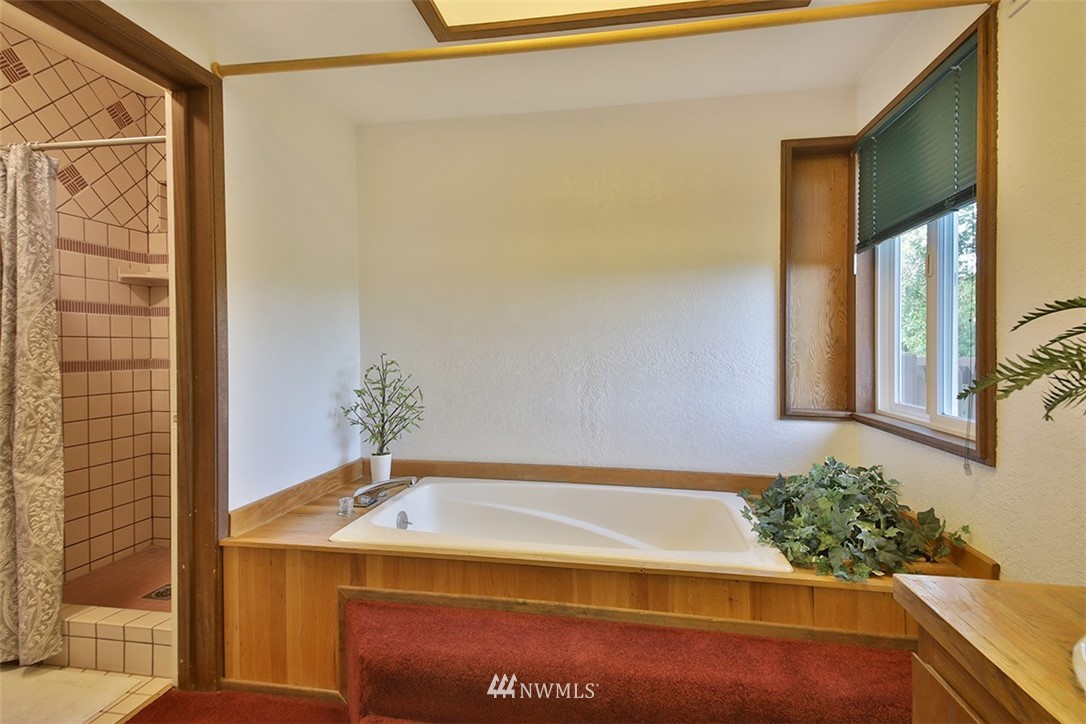5749 Double Bluff Road Freeland, WA 98249 - Photo 22 of 40 a bathroom with a tub and shower