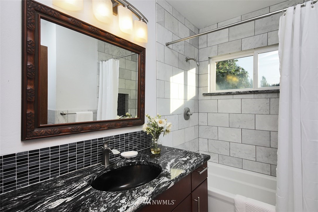 5749 Double Bluff Road Freeland, WA 98249 - Photo 25 of 40 a bathroom with a sink a bathtub and a shower