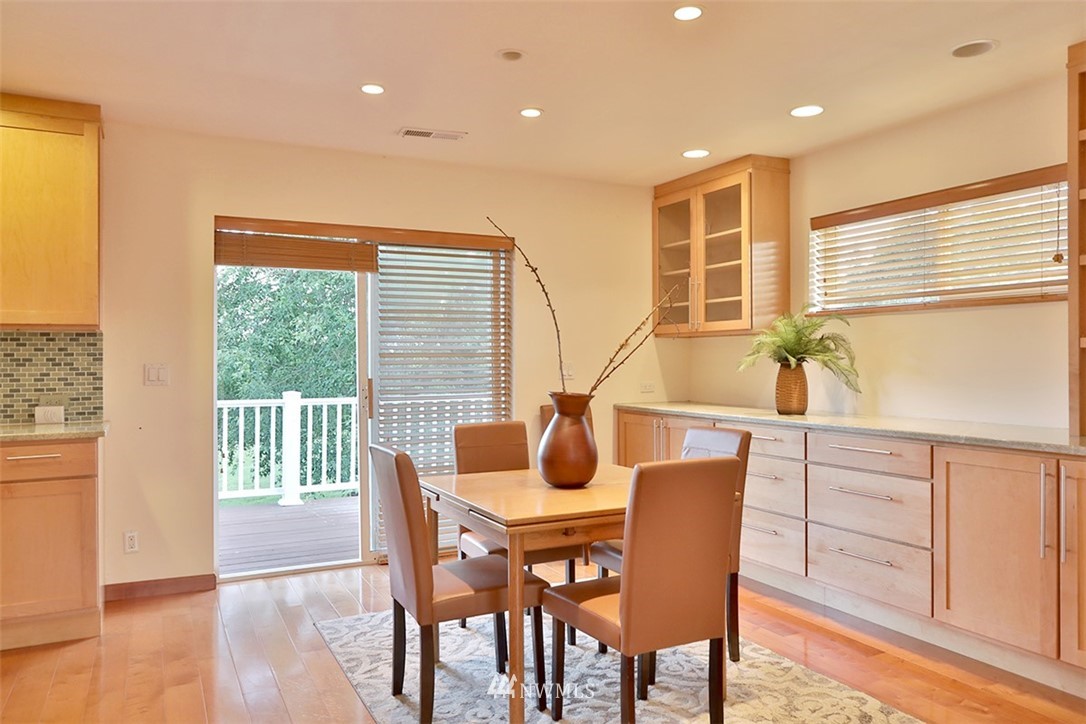 5749 Double Bluff Road Freeland, WA 98249 - Photo 31 of 40 a dining room with furniture window wooden floor