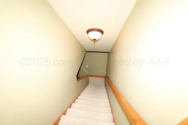 a room with furniture and a flat screen tv