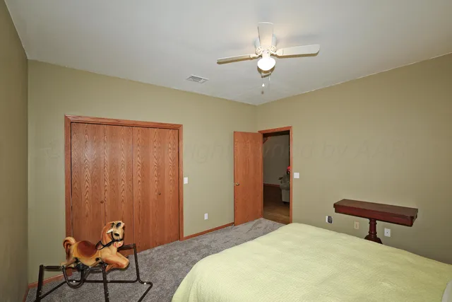 a view of a chair and tables in the patio