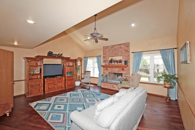 a view of a hallway with a couch and chandelier