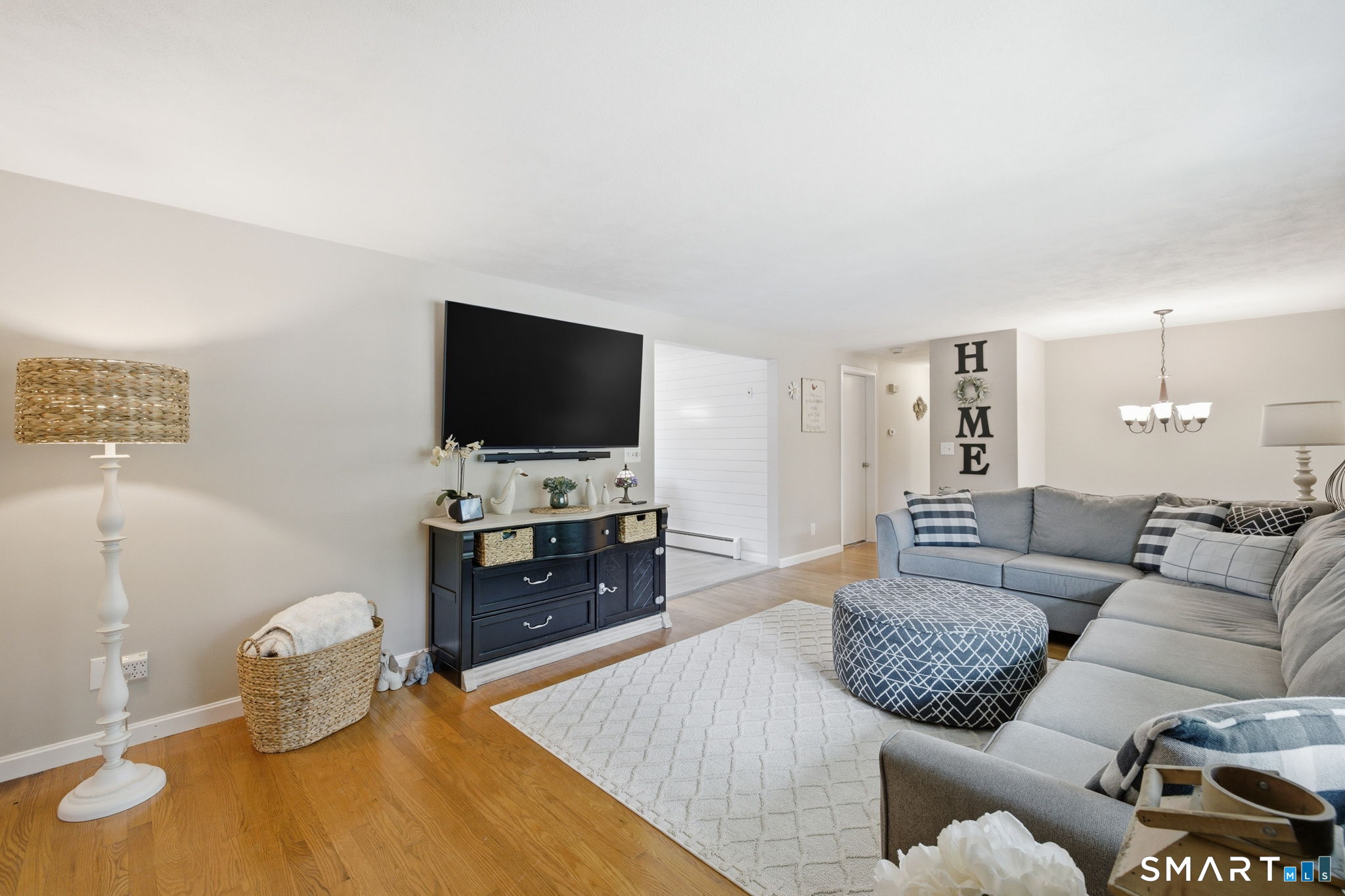 7 Stardust Drive Enfield, CT 06082 - Photo 5 of 38 a living room with furniture and a flat screen tv