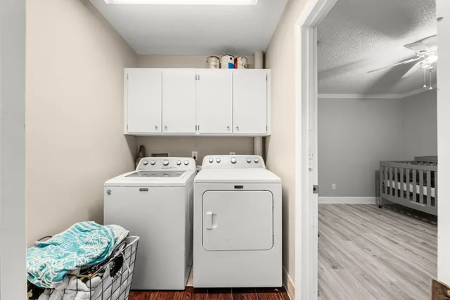 a utility room with dryer and washer