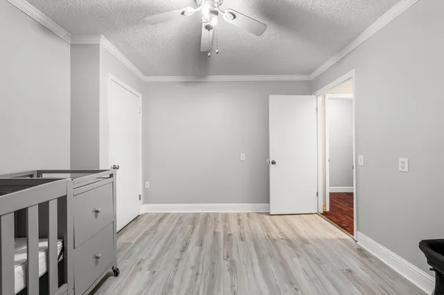 an empty room with wooden floor