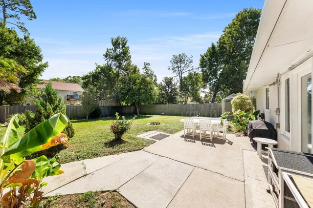 a front view of a house with swimming pool having outdoor seating