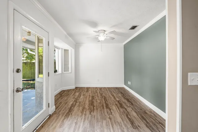a view of kitchen with refrigerator stove microwave and cabinets