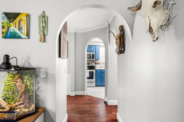 a view of an entryway with wooden floor