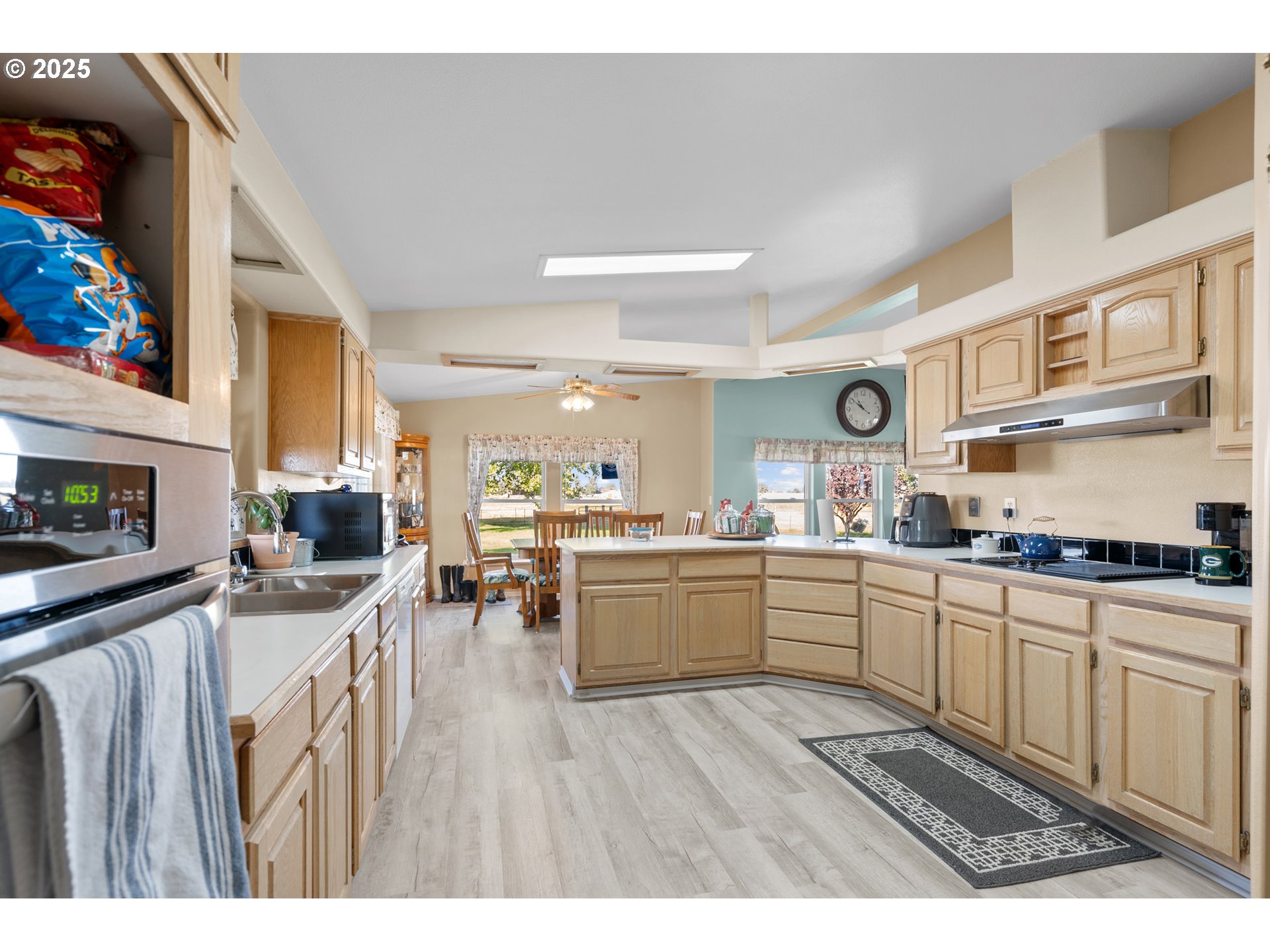34656 County 1172 Road Stanfield, OR 97875 - Photo 24 of 47 a kitchen with stainless steel appliances granite countertop lots of counter top space and wooden floors